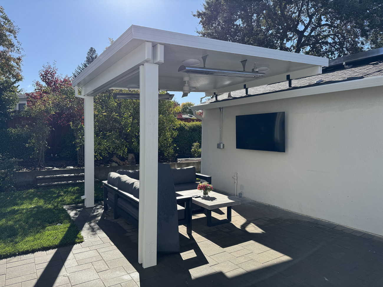 Covered patio with pergola, outdoor bar, and lounge seating